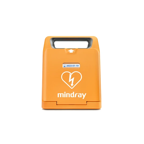 Orange defibrillator med hjärtsymbol och datumetikett.