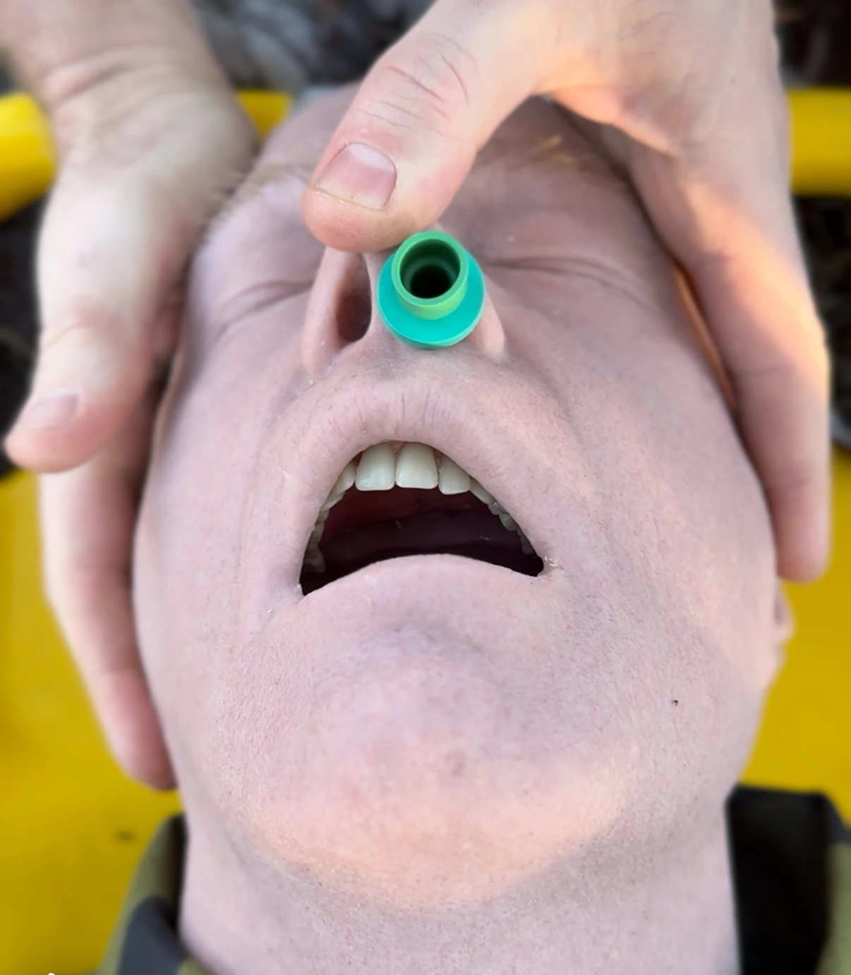 Nasal airway insertion on a medical mannequin.
